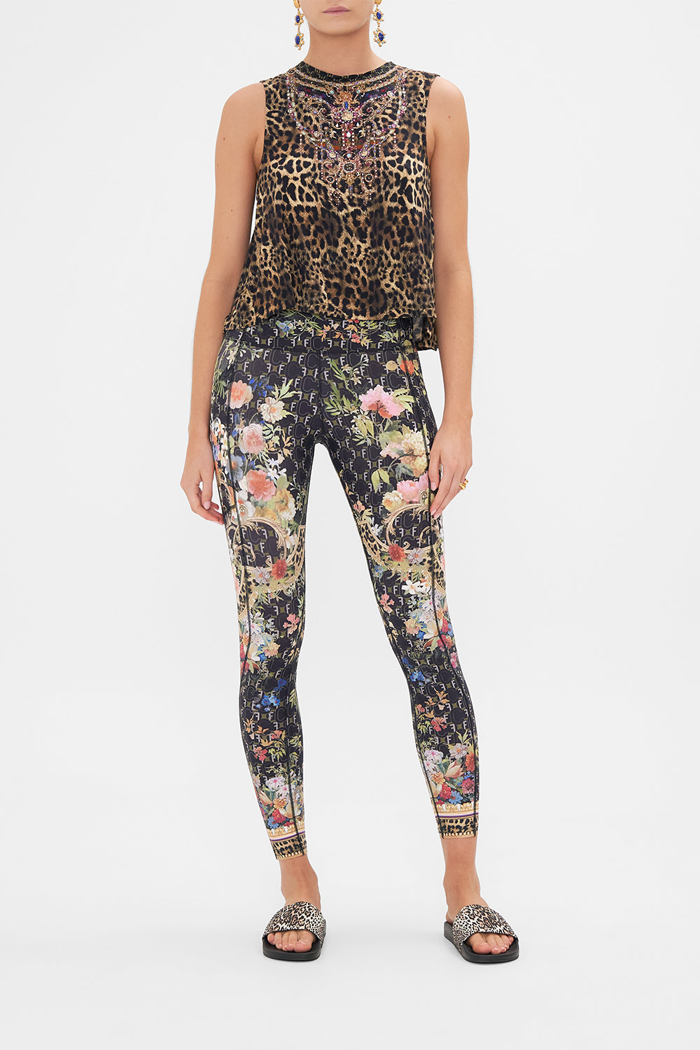 Front view of model wearing CAMILLA activewear oversized tank in A Gift from The Baron print