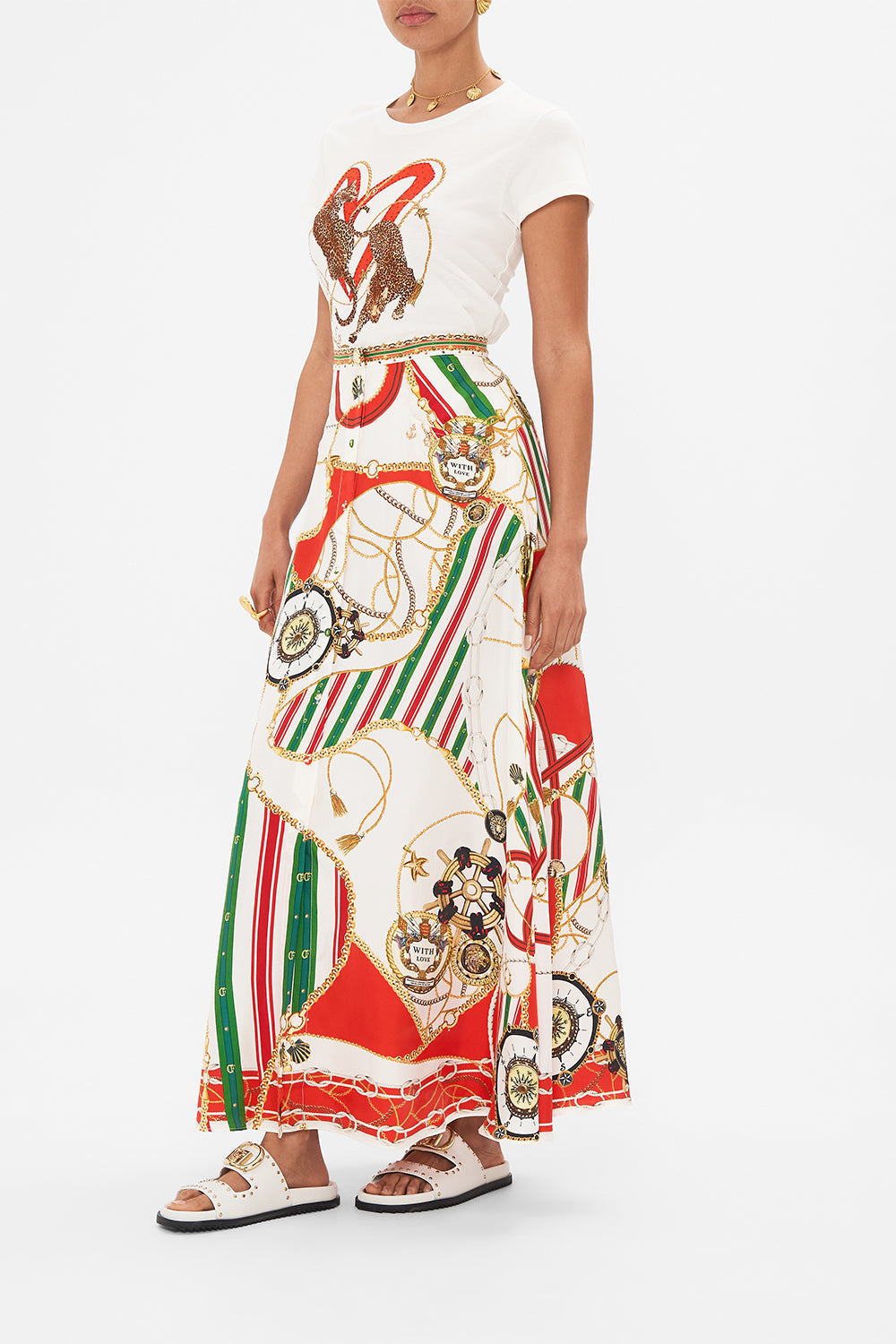 Crop view of model wearing CAMILLA button through skirt in Saluti Summertime print