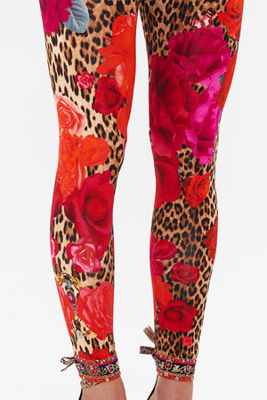 Detail view of model wearing CAMILLA designer leggings in Heart Like A Wildflower print 