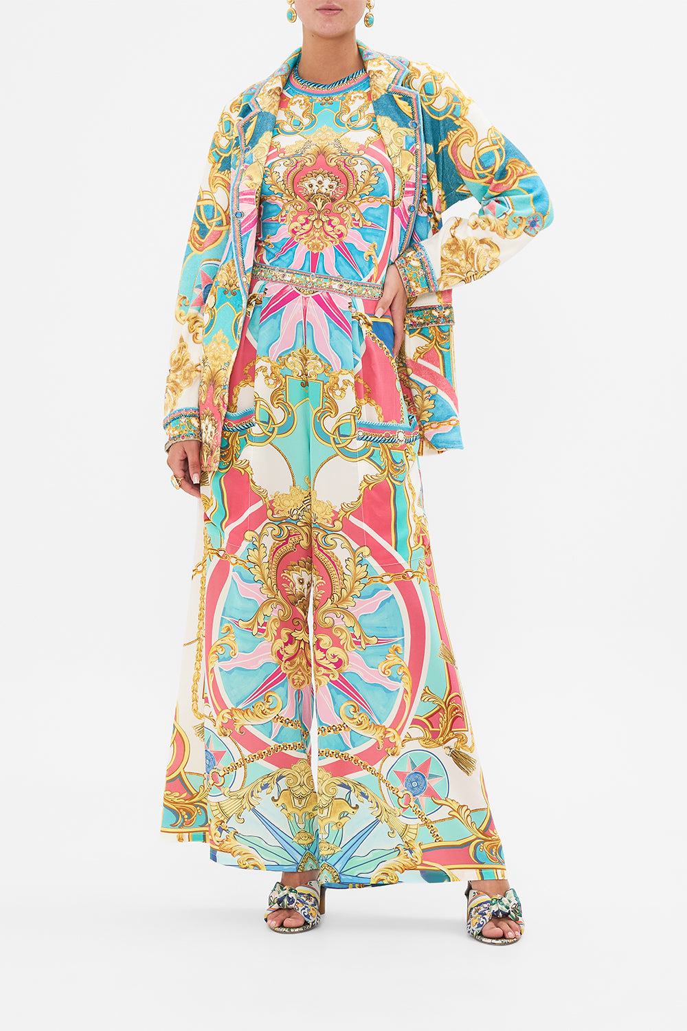 Side view of model wearing CAMILLA silk trouser in Sail Away With Me print 