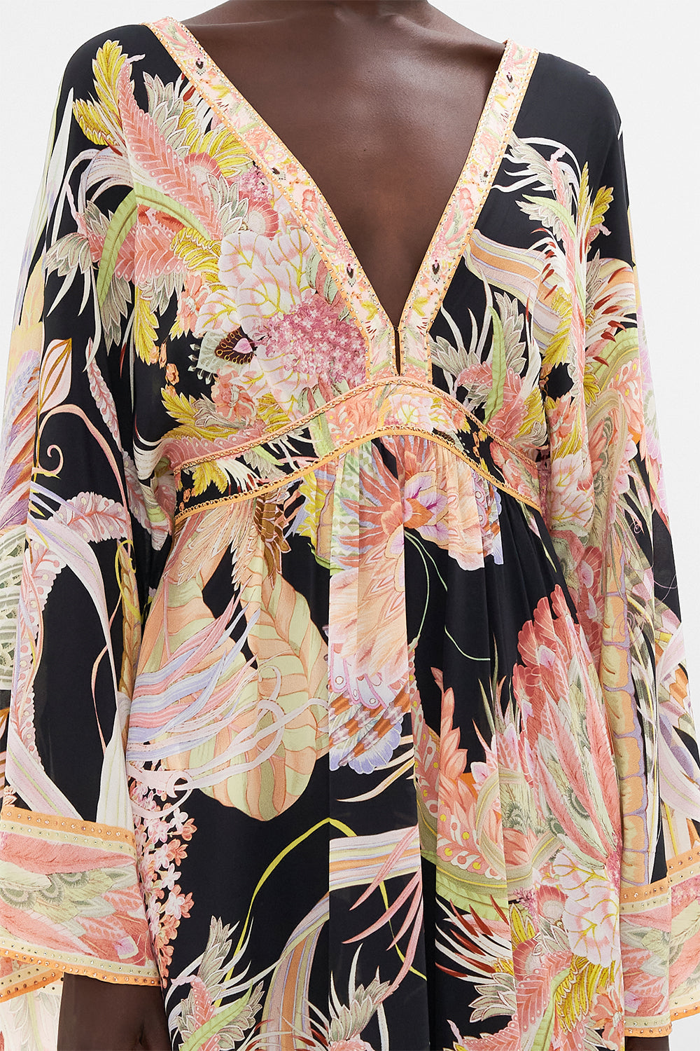 Detail view of model wearing CAMILLA designer silk dress in Lady Of The Moon print