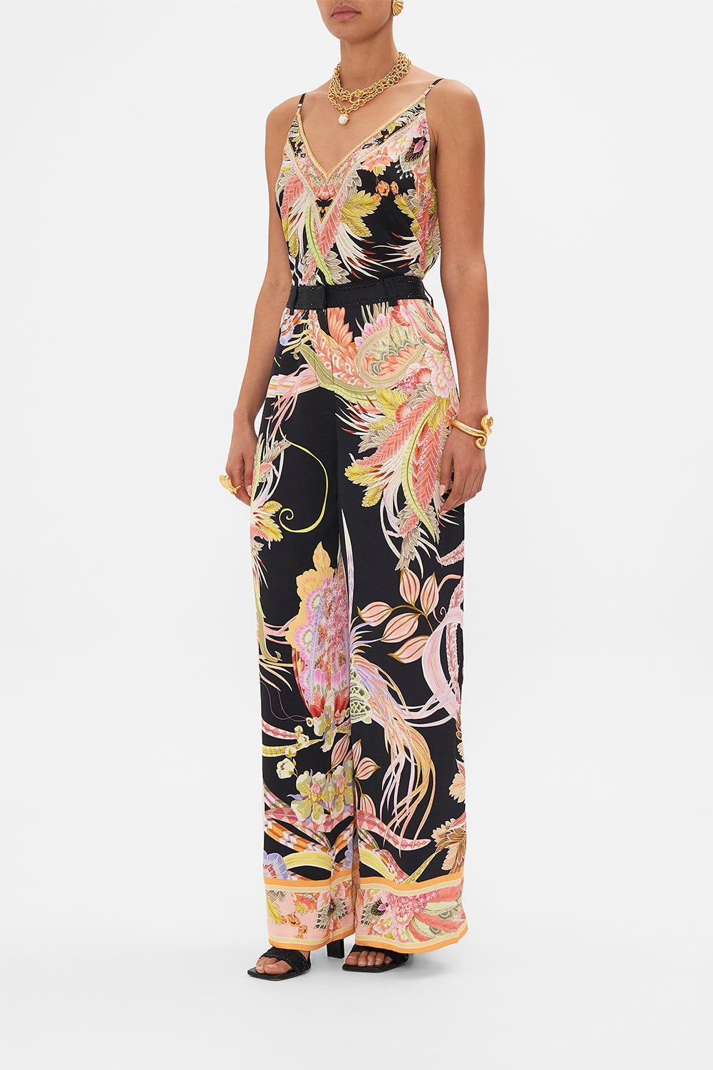 Side view of model wearing CAMILLA designer wide leg pants in Lady of The Moon print