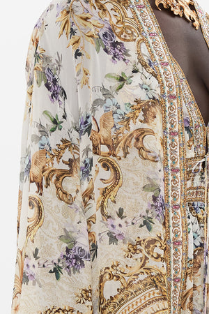 Detail view of model wearing CAMILLA silk robe in Palazzo Playdate print 
