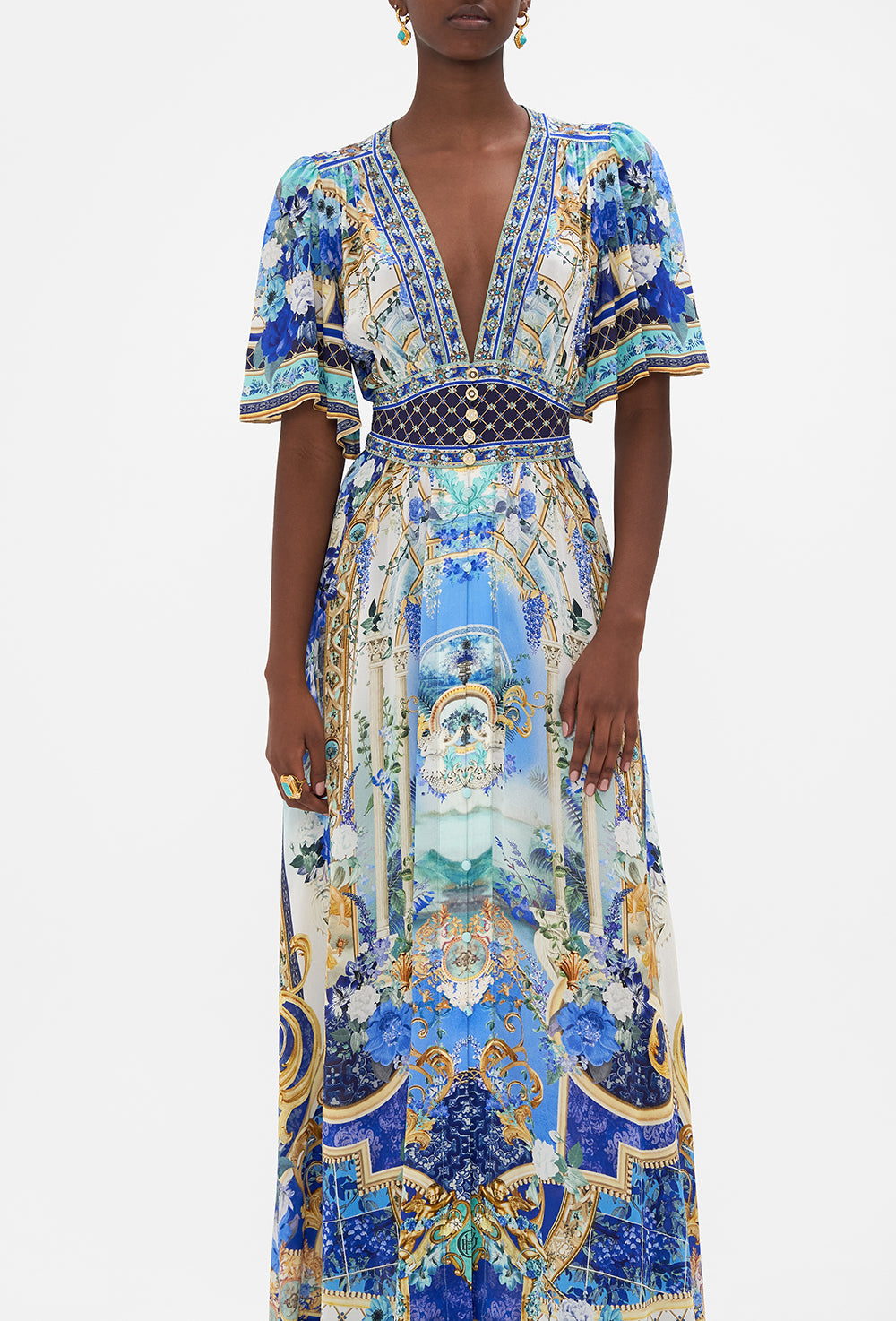 Crop view of model wearing CAMILLA silk dress with flutter sleeves in Views Of Vesuvius print