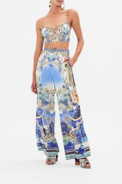 Front view of model wearing CAMILLA silk pants in Views Of Vesuvius print