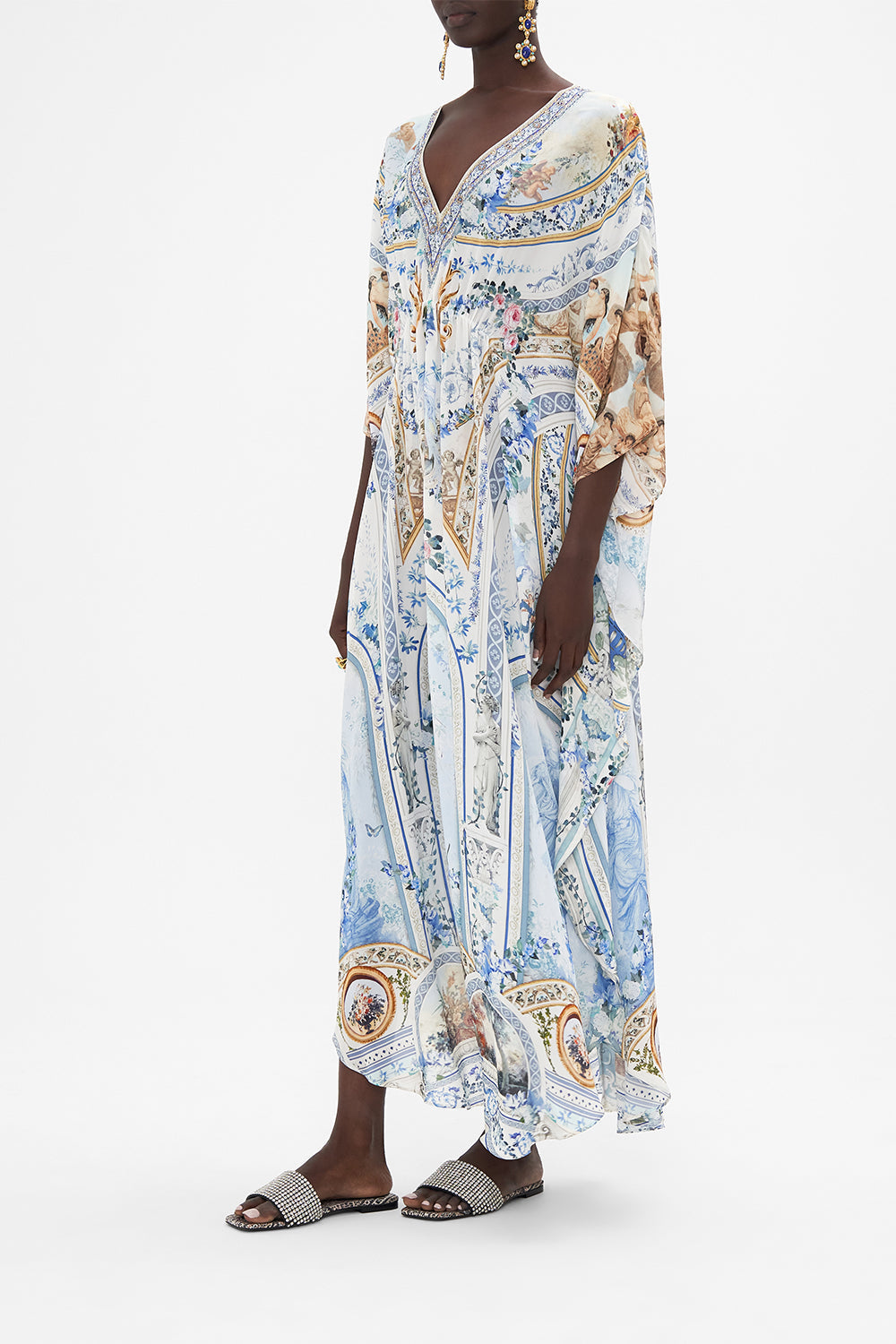 Side view of model wearing CAMILLA silk kaftan in Season of The Siren print 