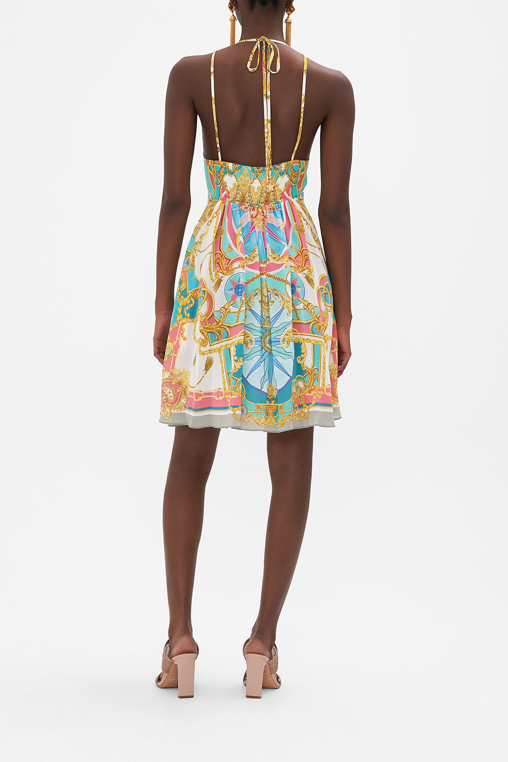 Back view of model wearing CAMILLA silk mini dress in Sail Away With Me print 