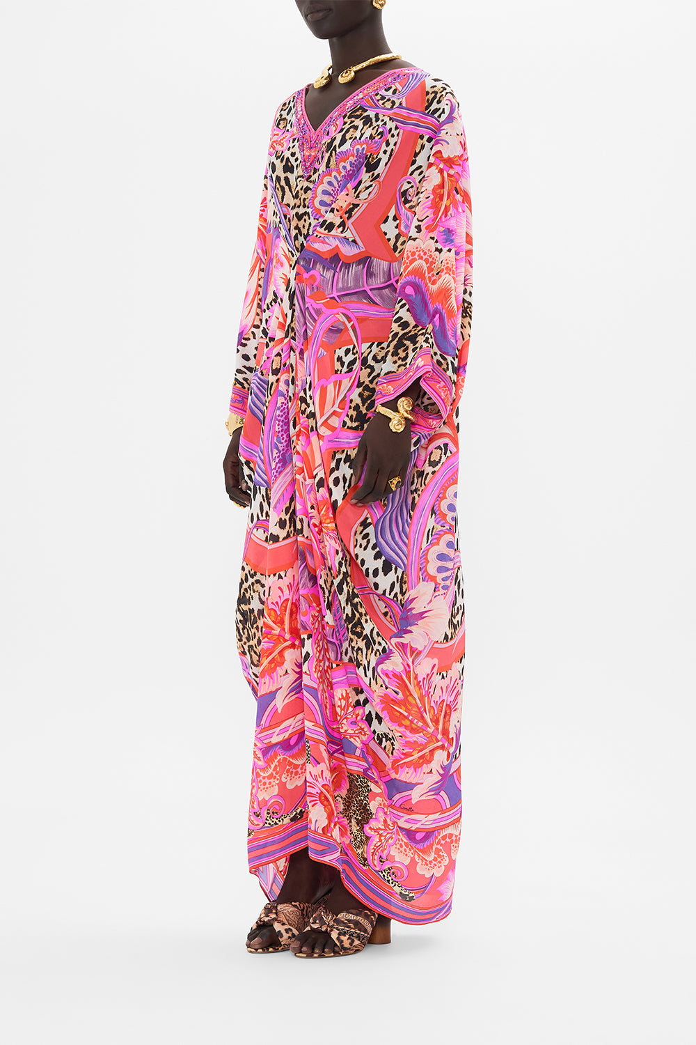 Side view of model wearing CAMILLA designer resortwear kaftan in Viola Vintage print 