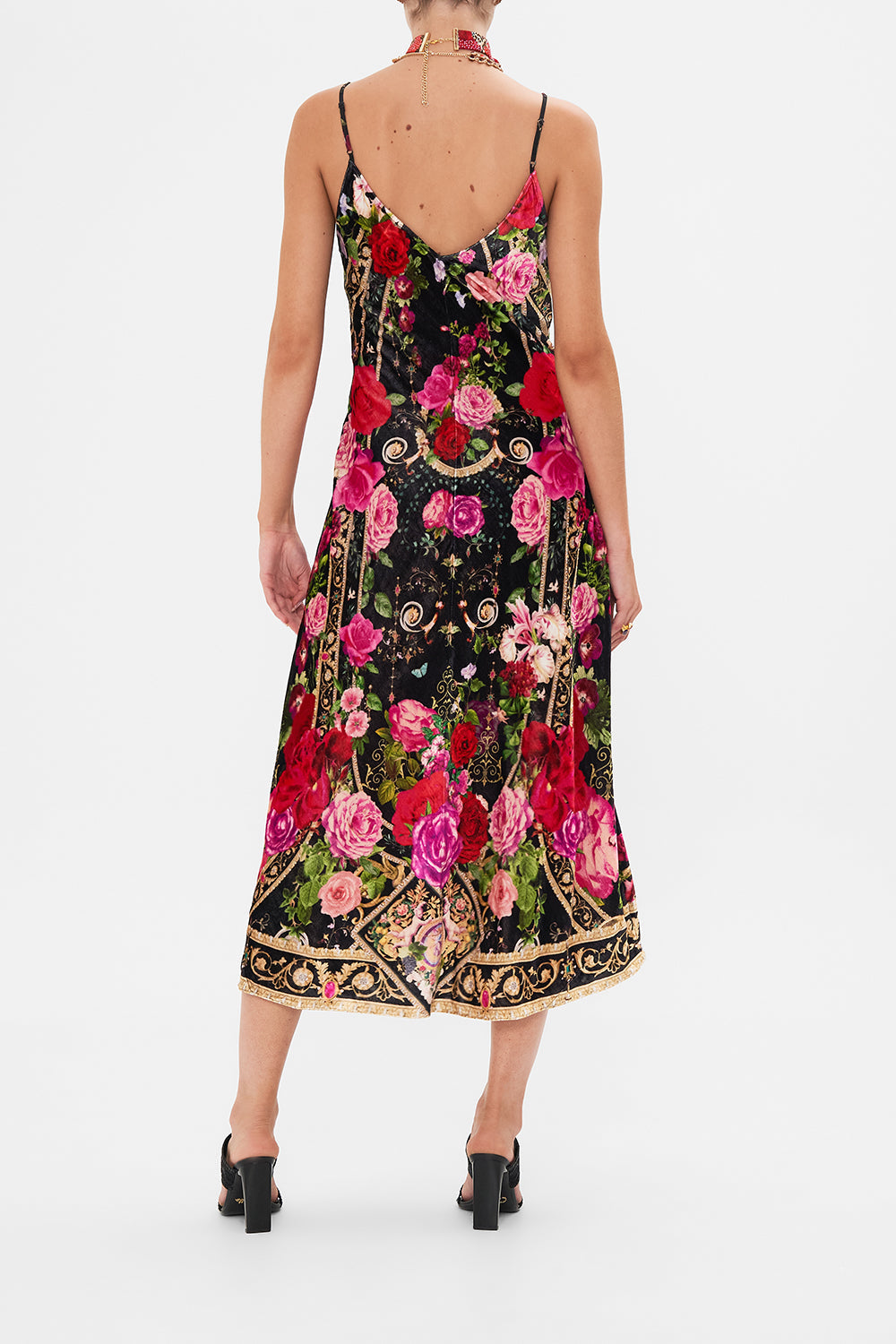 Back view of model wearing CAMILLA velvet slip dress in Reservation For Love