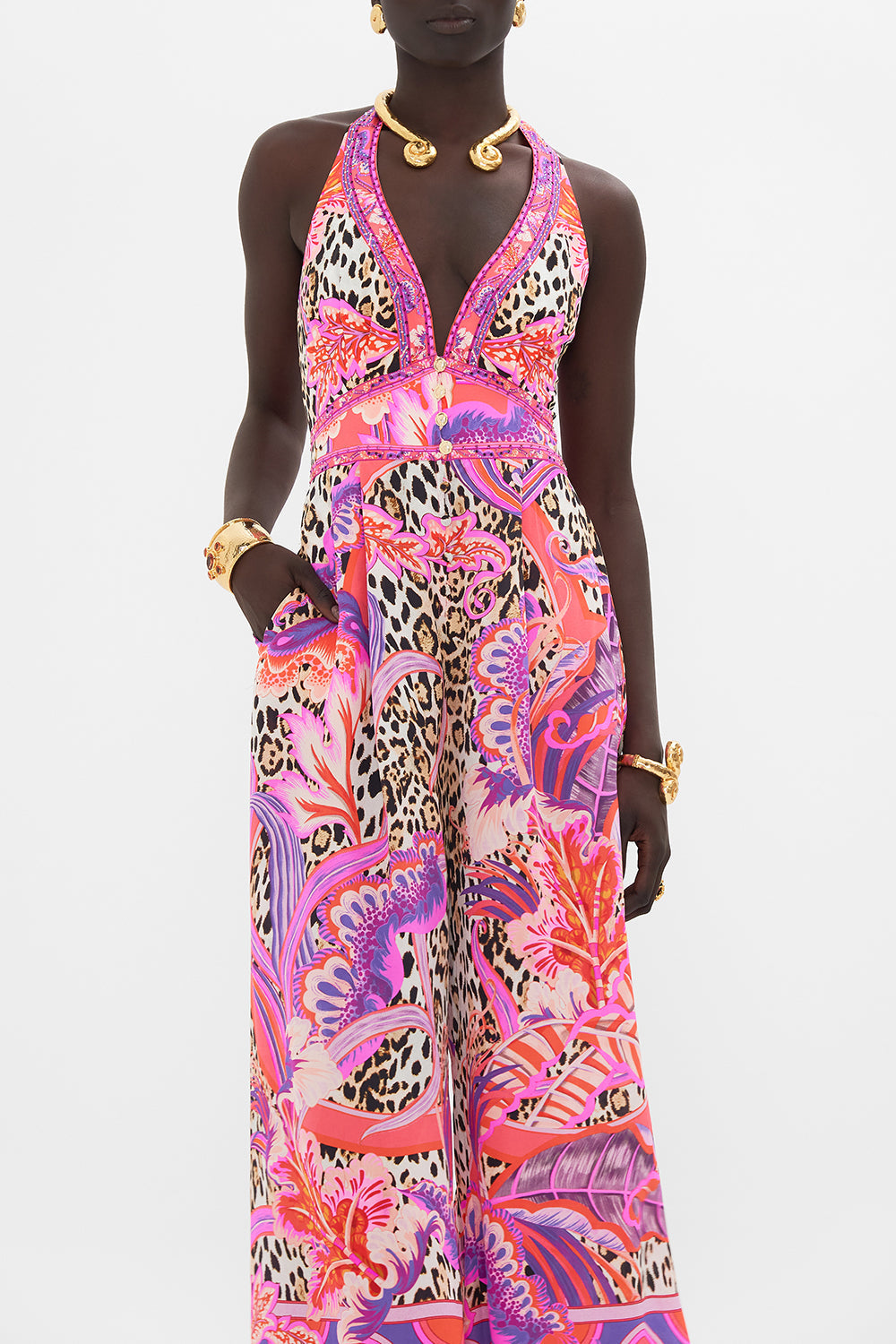 Crop view of model wearing CAMILLA silk halterneck jumpsuit in Viola Vintage print