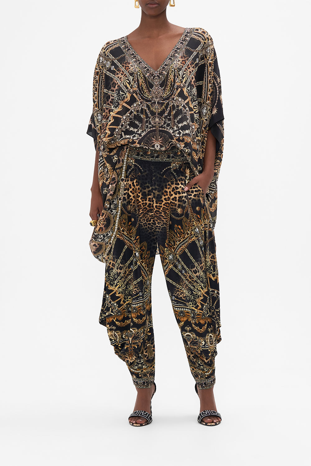 Crop view of model wearing CAMILLA siilk kaftan in masked At Moonlight print