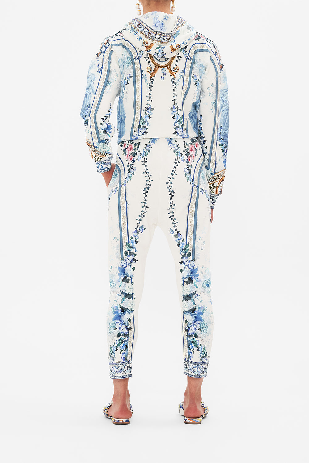 Back view of model wearing CAMILLA designer pants in Season Of The Siren print 