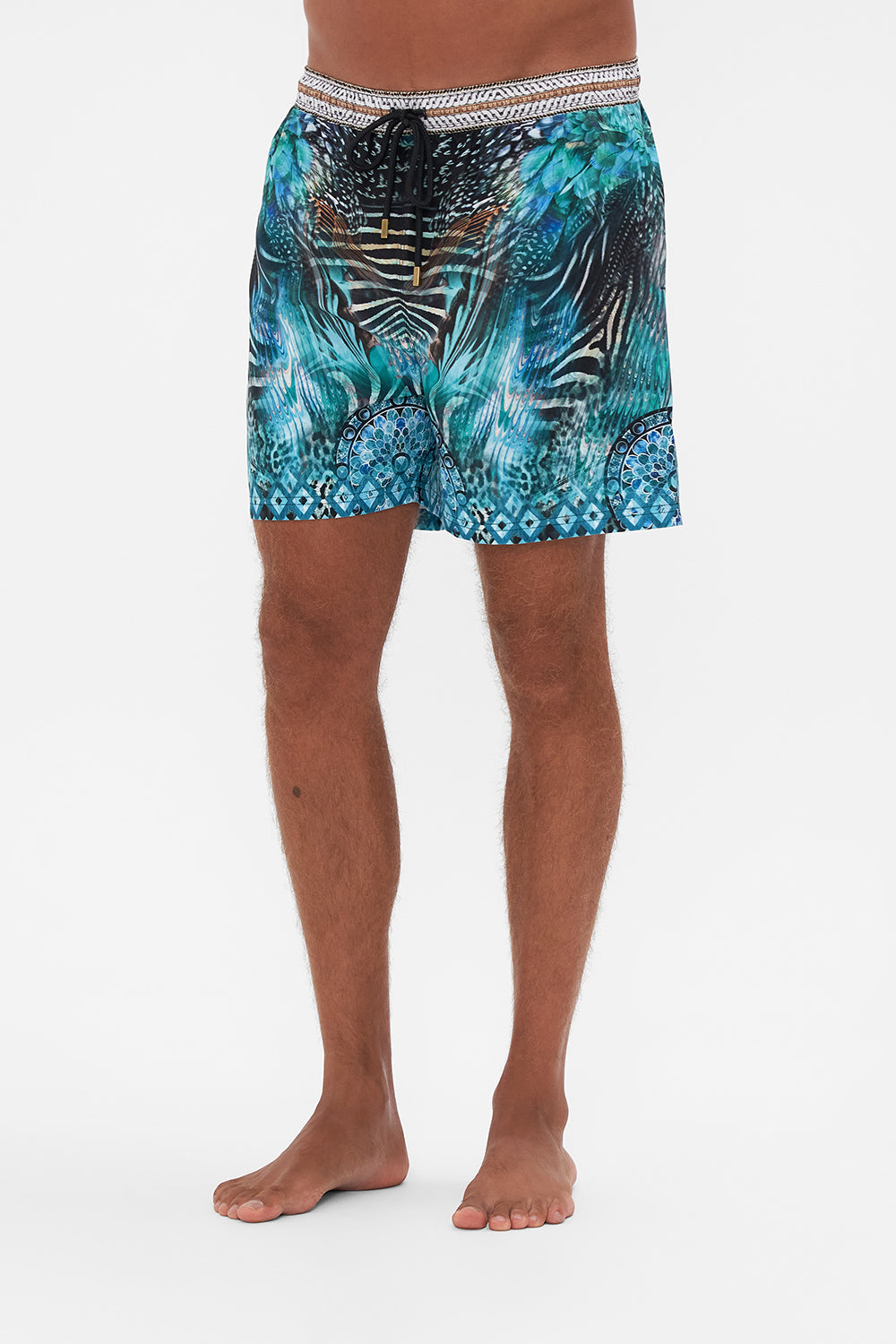 Crop view of model wearing Hotel Franks By CAMILLA luxury mens boardshorts in Azure Allure
