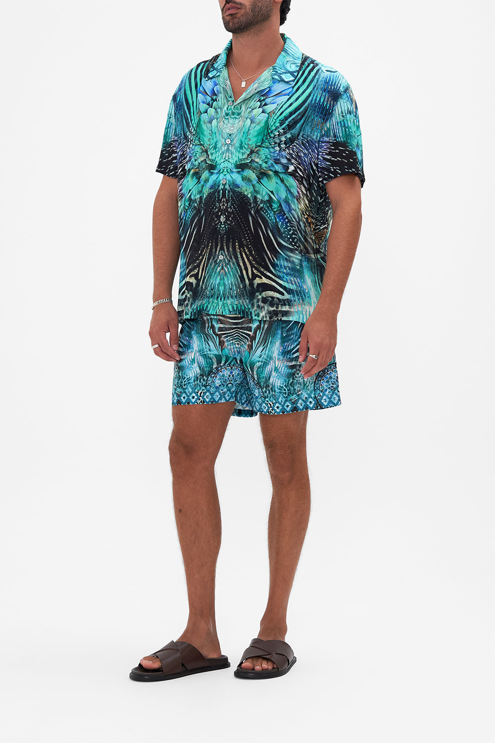 Side view of  model wearing Hotel Franks By CAMILLA mens short sleeve camp collared shirt in Azure Allure