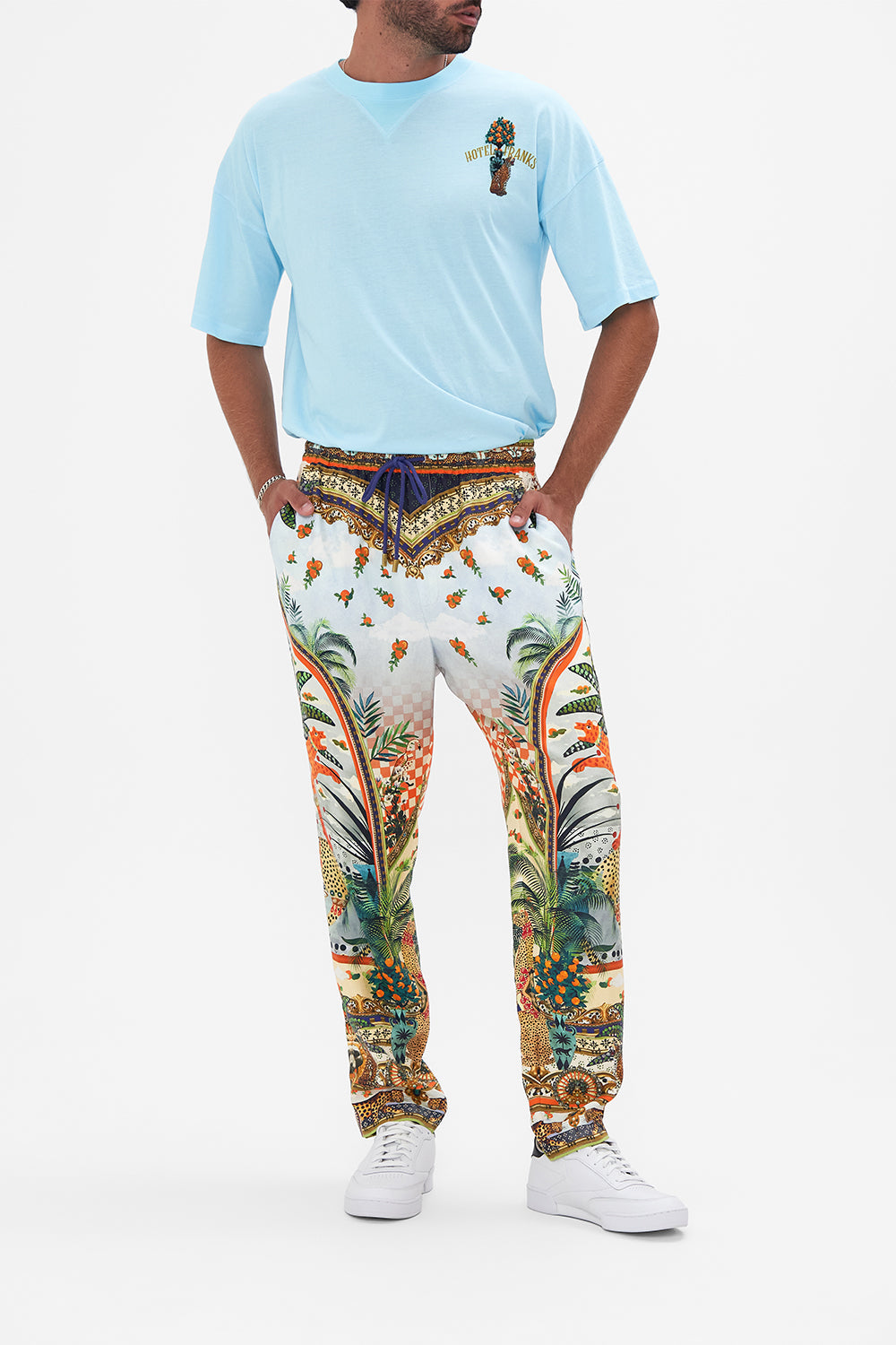 Front view of model wearing HOTEL FRANKS BY CAMILLA mens elasticated pants in Alessandro's Atlantis print