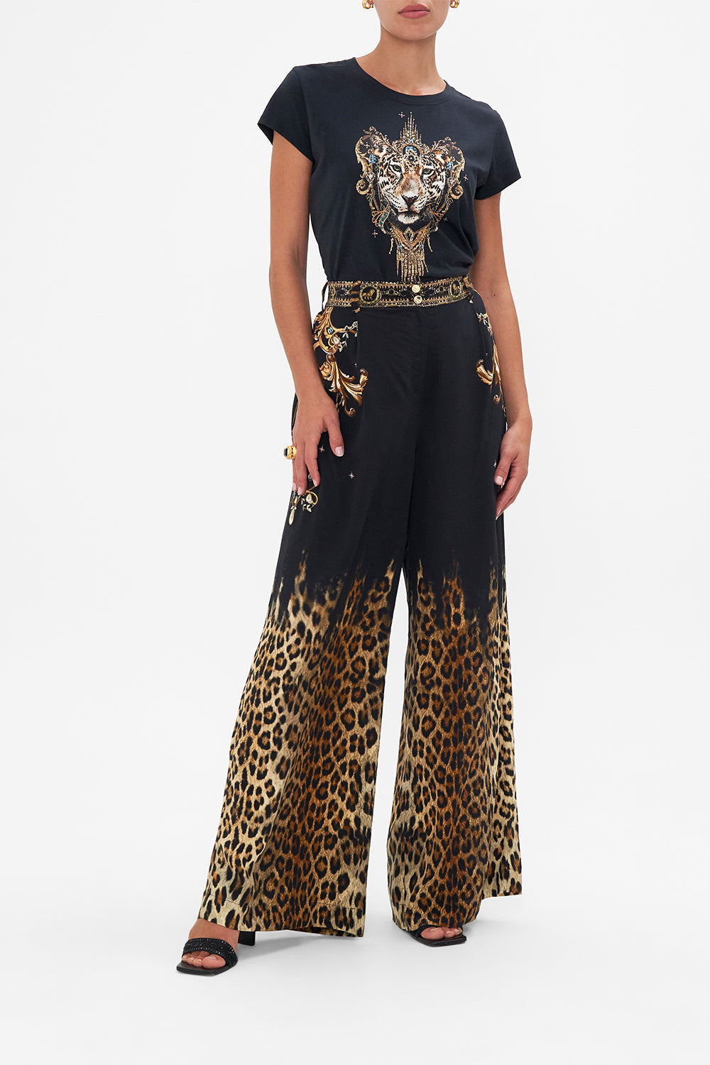 Front tucked view of model wearing CAMILLA black graphic tee in Lions Mane print