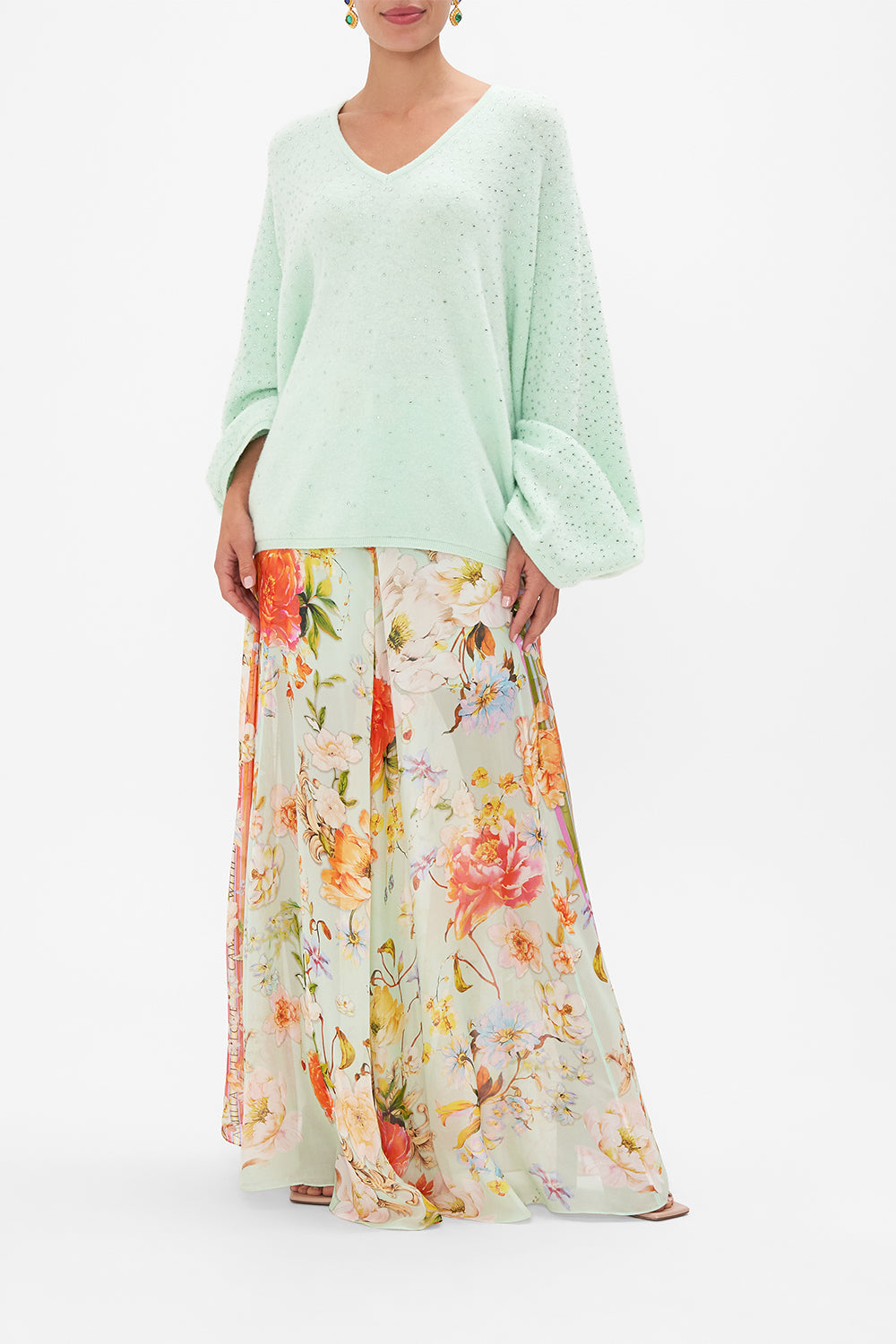 Front untucked view of model wearing CAMILLA v neck knit jumper in mint 