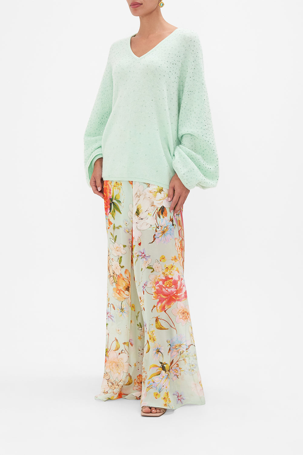 Side view of model wearing CAMILLA v neck knit jumper in mint 