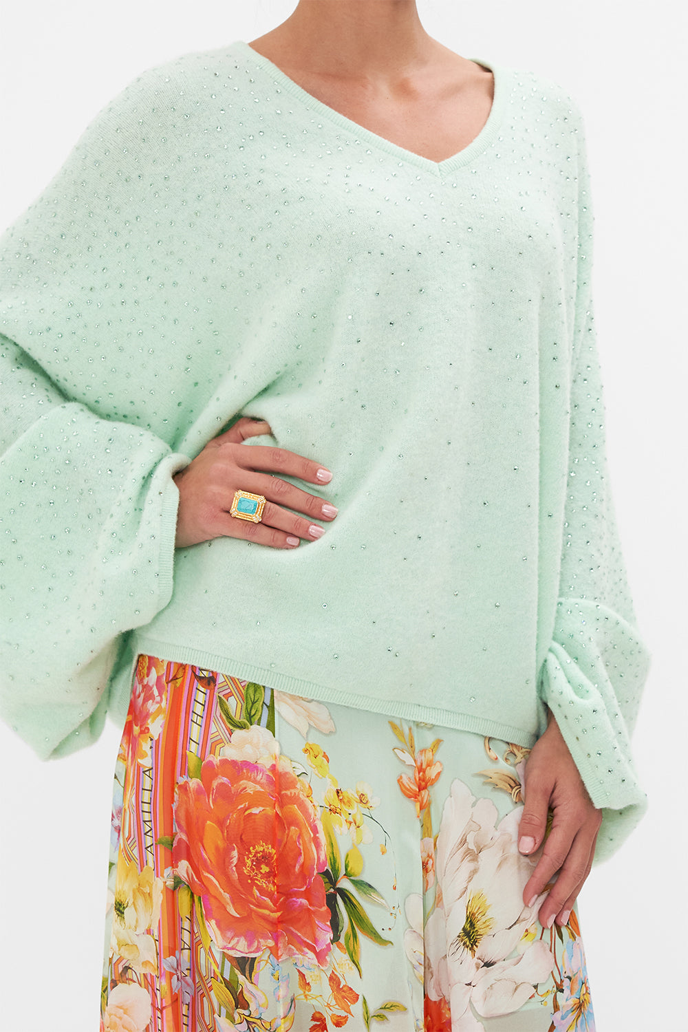 Detail view of model wearing CAMILLA v neck knit jumper in mint 