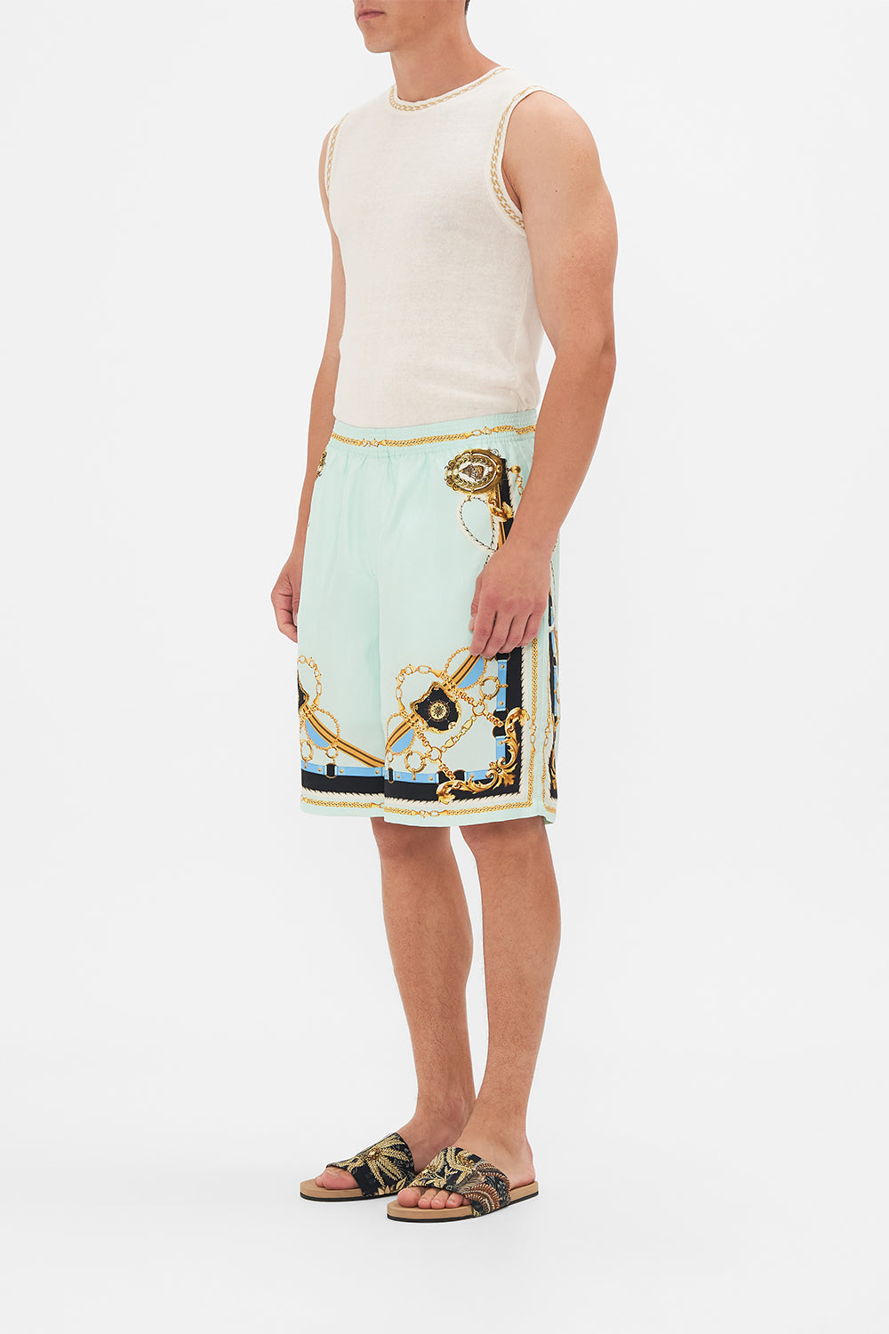 Side view of model wearing Hotel Franks By CAMILLA mens walk short in Sea Charm print 