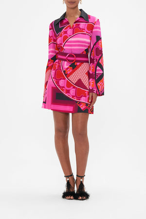 Front view of model wearing CAMILLA pink mini dress in Ciao Palazzo print