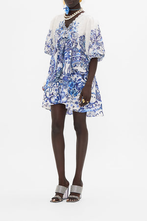 Side view of model wearing CAMILLA mini dress in Glaze And Graze print