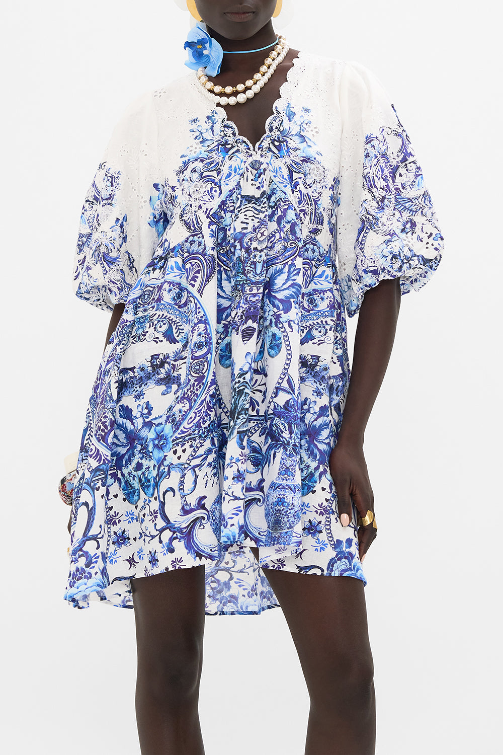 Crop view of model wearing CAMILLA mini dress in Glaze And Graze print