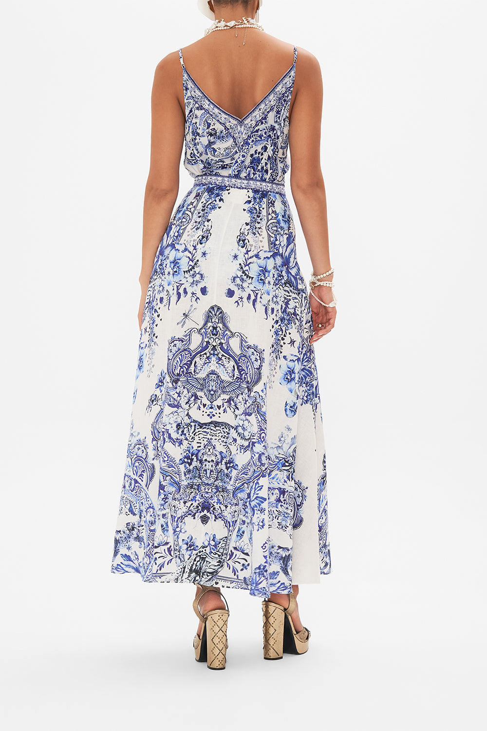 Back view of model wearing CAMILLA silk skirt in Glaze and Graze print