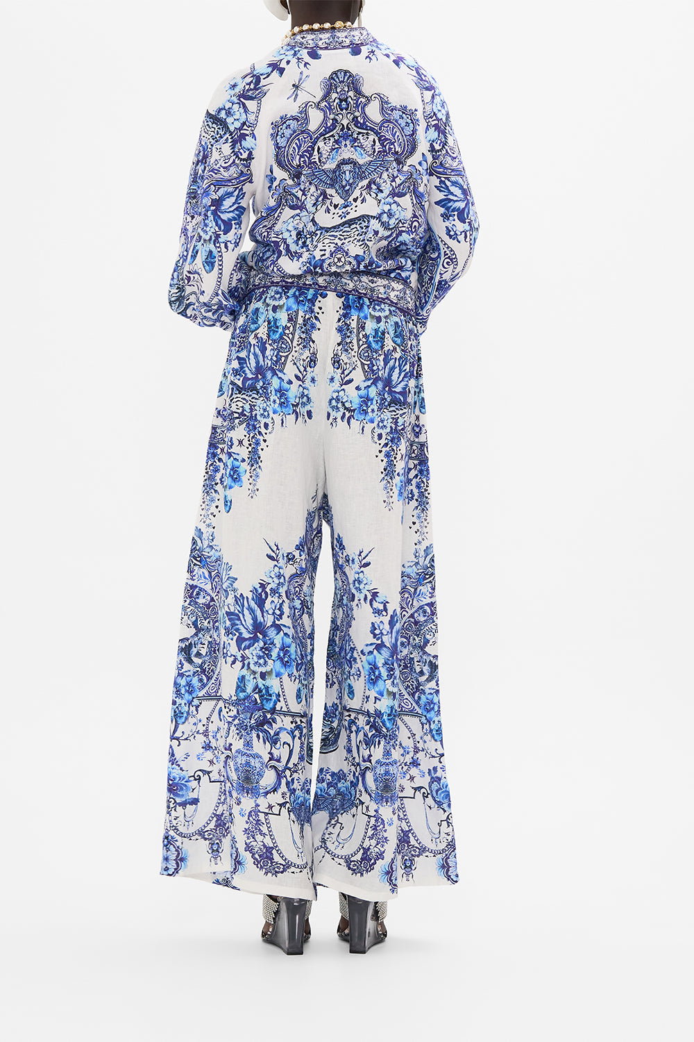 Back view of model wearing CAMILLA silk bomber jacket in Glaze and Graze print