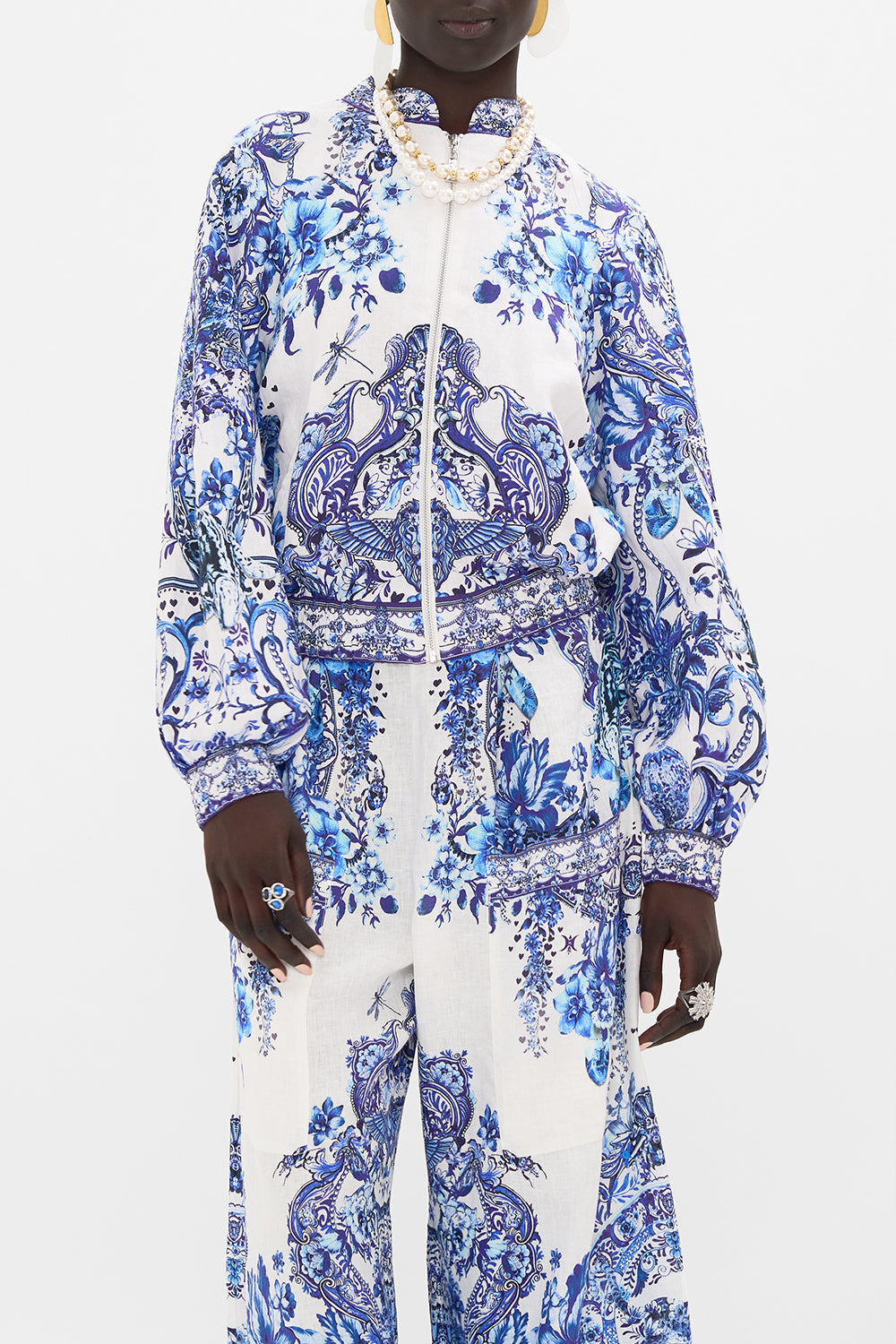 Crop view of model wearing CAMILLA silk bomber jacket in Glaze and Graze print