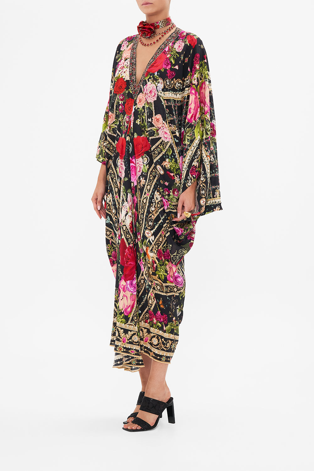 Side view of model wearing CAMILLA  designer resort wear silk kaftan print in Reservation For Love print 