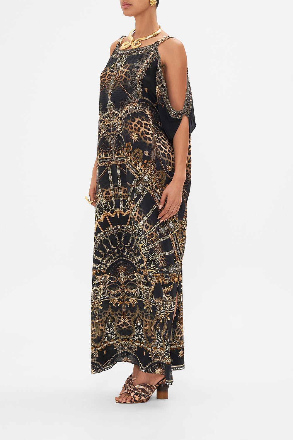 Side view of model wearing CAMILLA silk kaftan with hardware in Masked  at Moonlight print