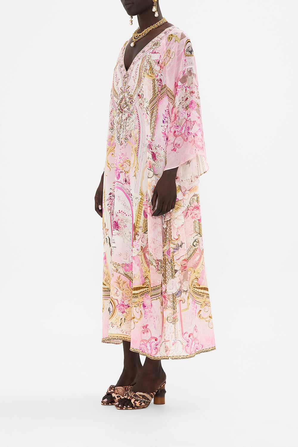 Side view of model wearing CAMILLA pink silk kaftan in Fresco Fairytale print