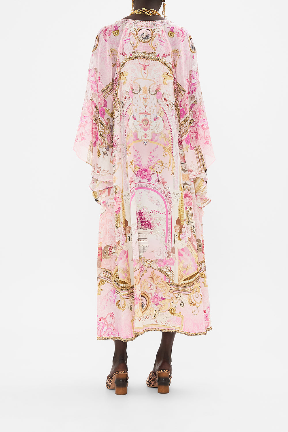 Back view of model wearing CAMILLA pink silk kaftan in Fresco Fairytale print