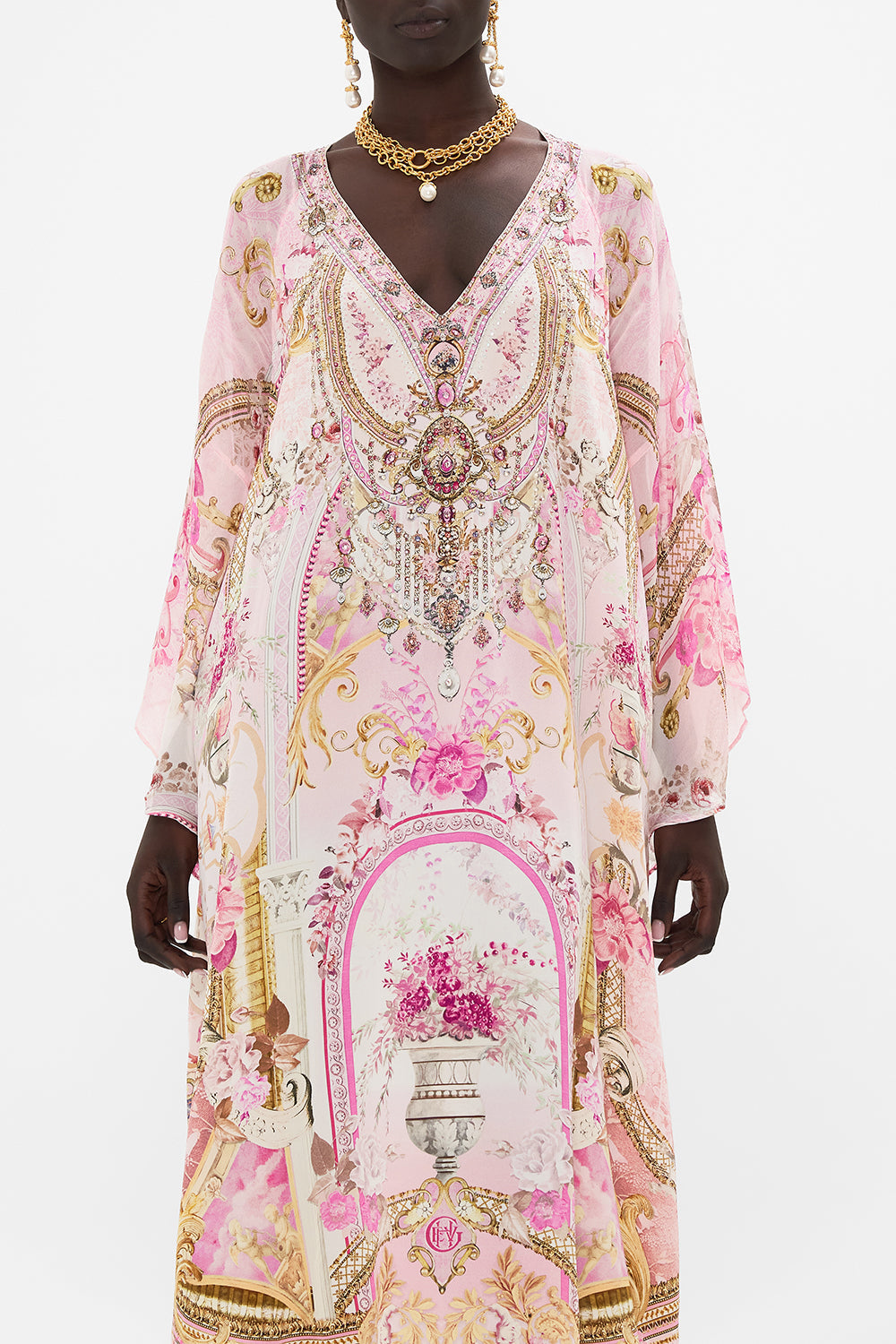 Crop view of model wearing CAMILLA pink silk kaftan in Fresco Fairytale print