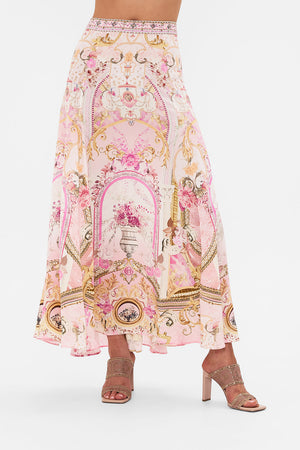 Crop view of model wearing CAMILLA pink maxi skirt in Fresco Fairytale print