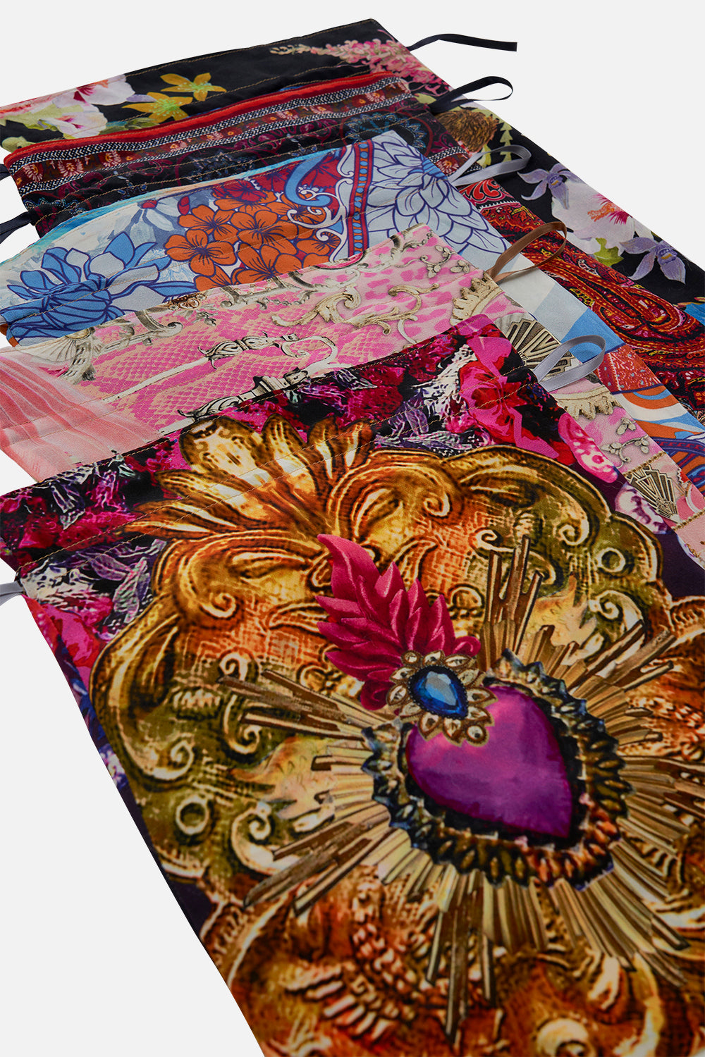 The CAMILLA THROW OVER WITH FEATHERS TILED IN TIME in our  print.