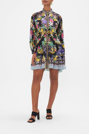 Front view of model wearing CAMILLA black floral print shirt dress in Meet Me In Marchesa print
