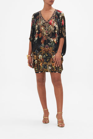 Front view of model wearing CAMILLA floral bat sleeve dress in A Night At The Opera print