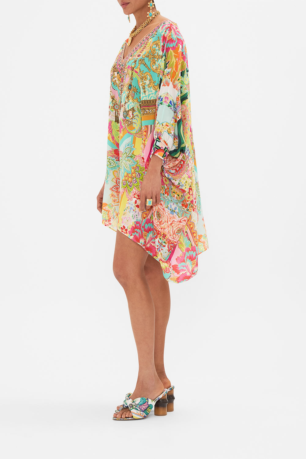 Side view of model wearing CAMILLA short silk kaftan in An Italian Welcome print
