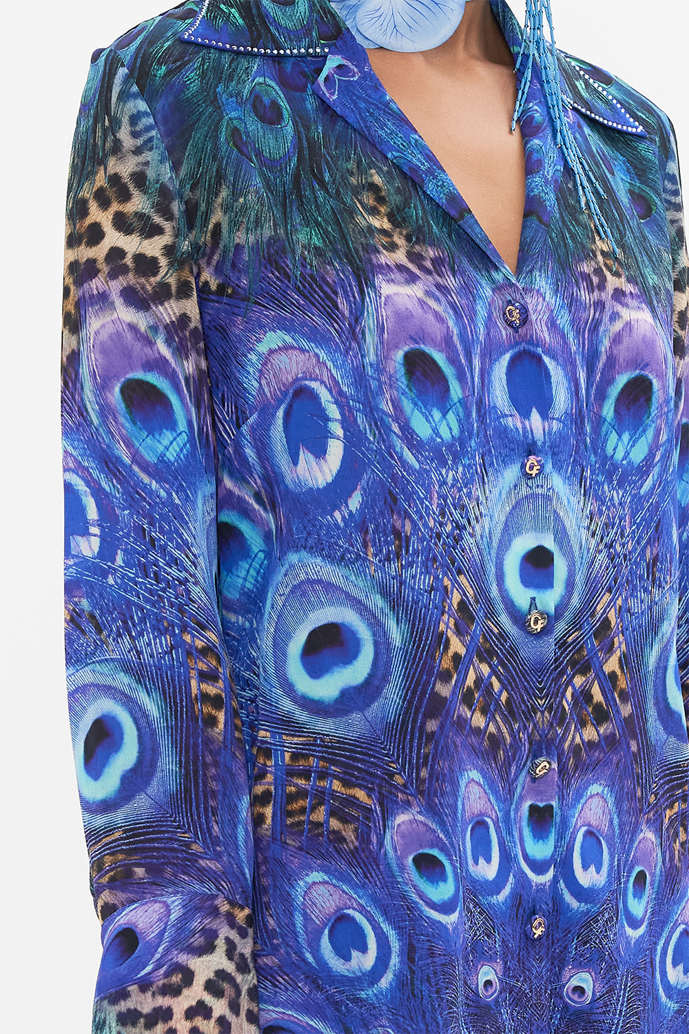 Detail view of model wearing CAMILLA silk shirt in Peacock Rock print