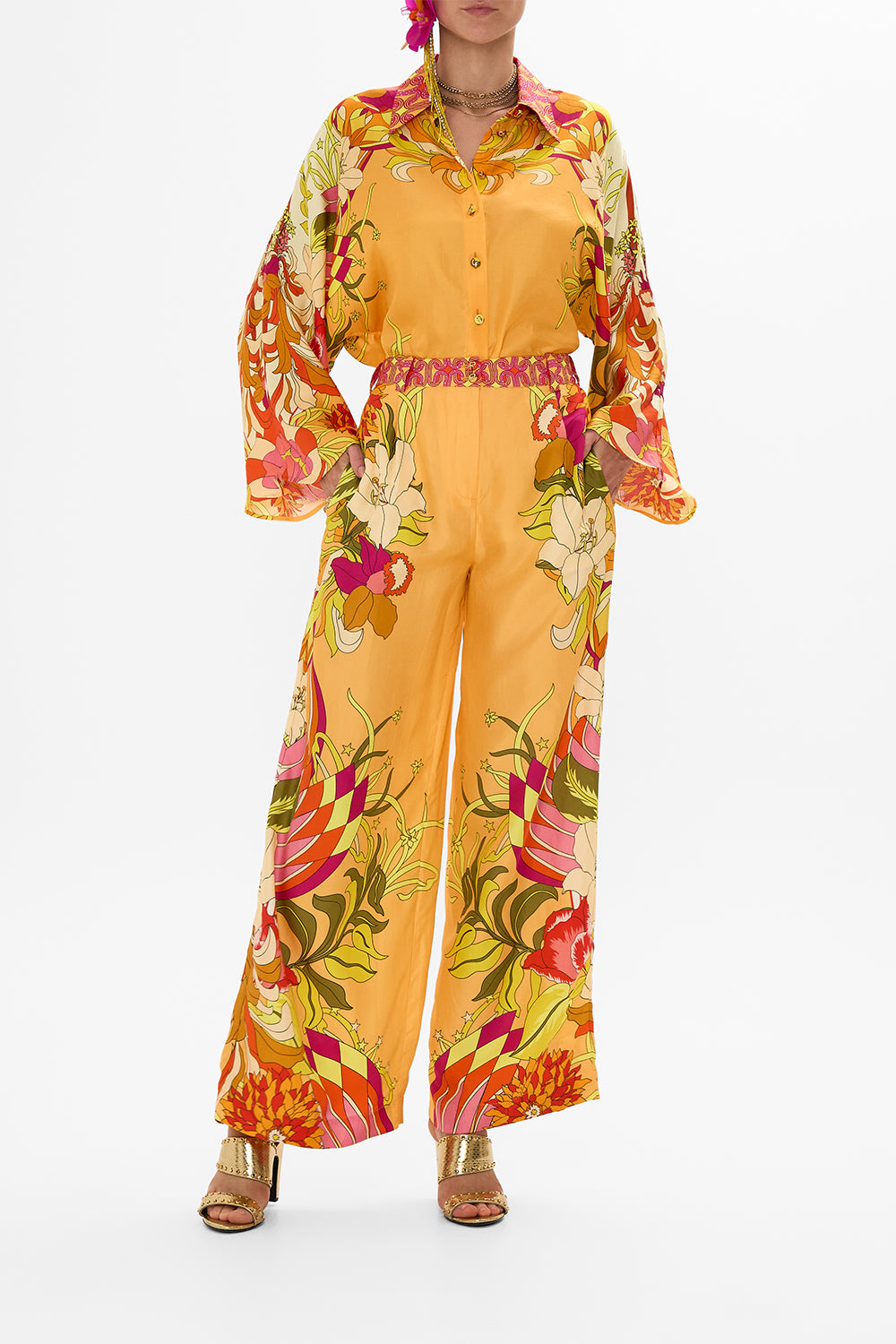 The CAMILLA HALTERNECK JUMPSUIT WITH TIE NECK COSMIC PRAIRIE in our  print.