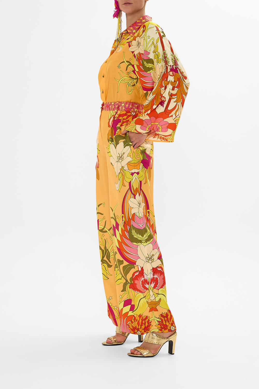 The CAMILLA HALTERNECK JUMPSUIT WITH TIE NECK COSMIC PRAIRIE in our  print.