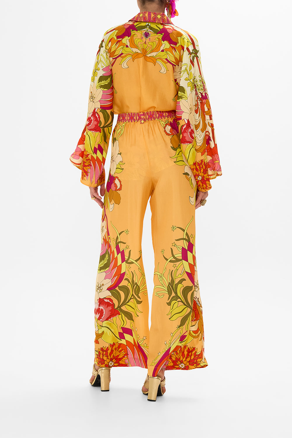 The CAMILLA HALTERNECK JUMPSUIT WITH TIE NECK COSMIC PRAIRIE in our  print.