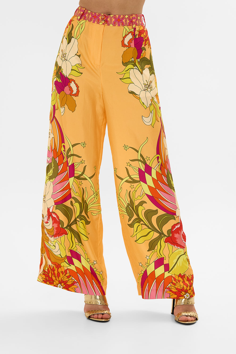 The CAMILLA HALTERNECK JUMPSUIT WITH TIE NECK COSMIC PRAIRIE in our  print.