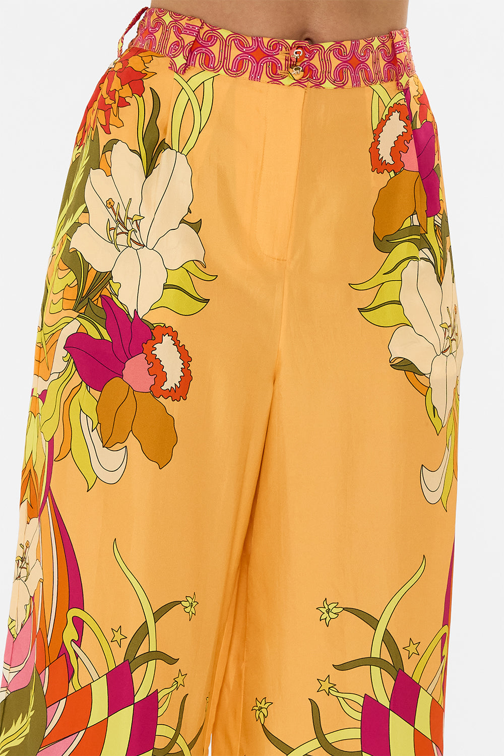 The CAMILLA HALTERNECK JUMPSUIT WITH TIE NECK COSMIC PRAIRIE in our  print.