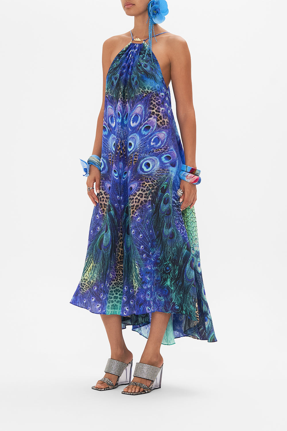 Side view of model wearing CAMILLA silk maxi dress in Peacock Rock print