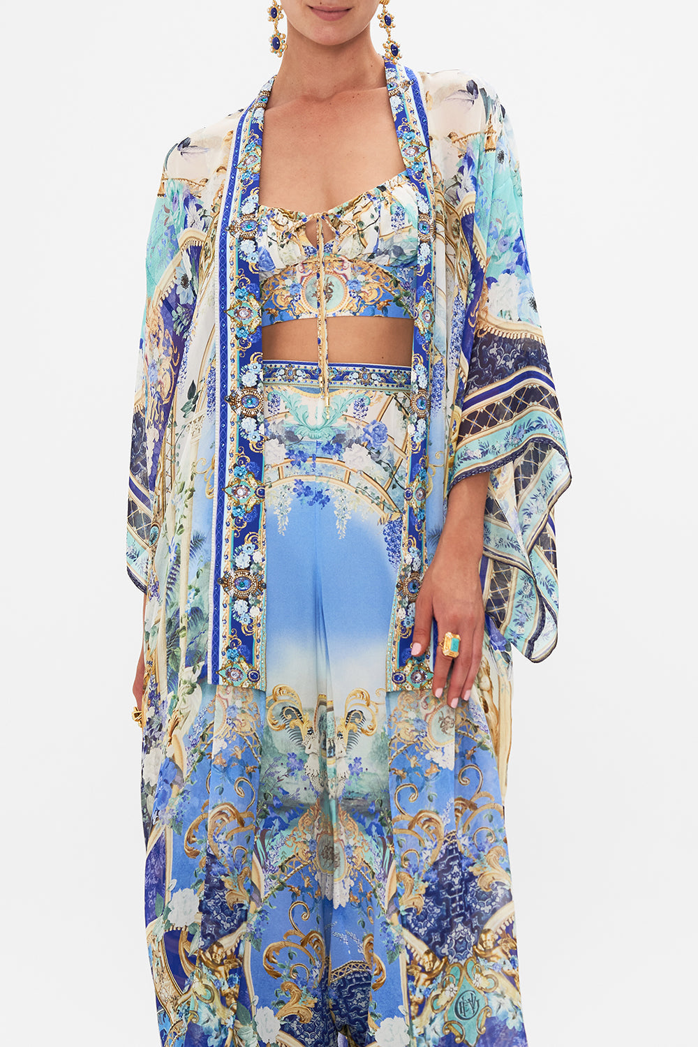 Crop view of model wearing CAMILLA silk kimono layer in Views Of Vesuvius print 