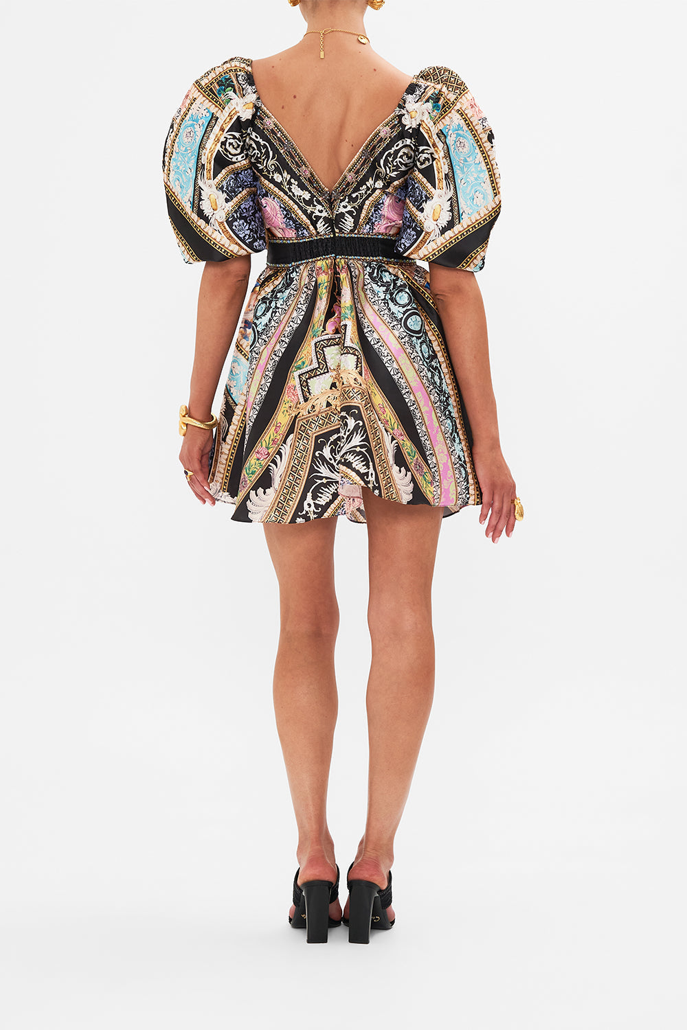 Back view of model wearing CAMILLA silk mini dress with puff sleeves in Florence Field Day print