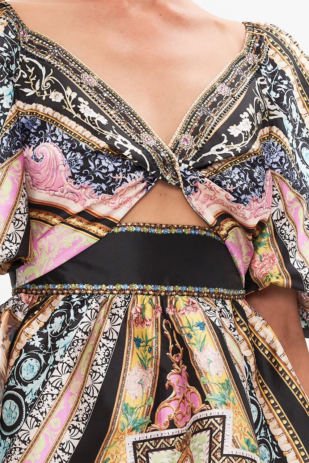 Detail view of model wearing CAMILLA silk mini dress with puff sleeves in Florence Field Day print